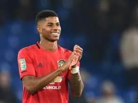 Rashford ve cerca a Jadon Sancho. AFP