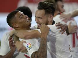 Ocampos (R) scored the first as Sevilla beat city rivals Betis 2-0. AFP
