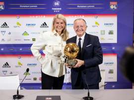 Jean-Michel Aulas with Ada Hegerberg and the Balon D'Or. AFP