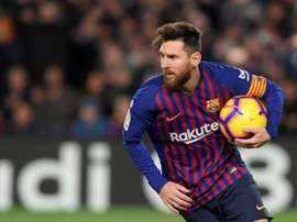 Lionel Messi netted twice to secure a draw for his team in tonight's clash with Valencia. AFP