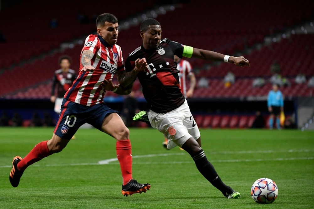 Alaba (R) wants to play in midfield at his new club. AFP