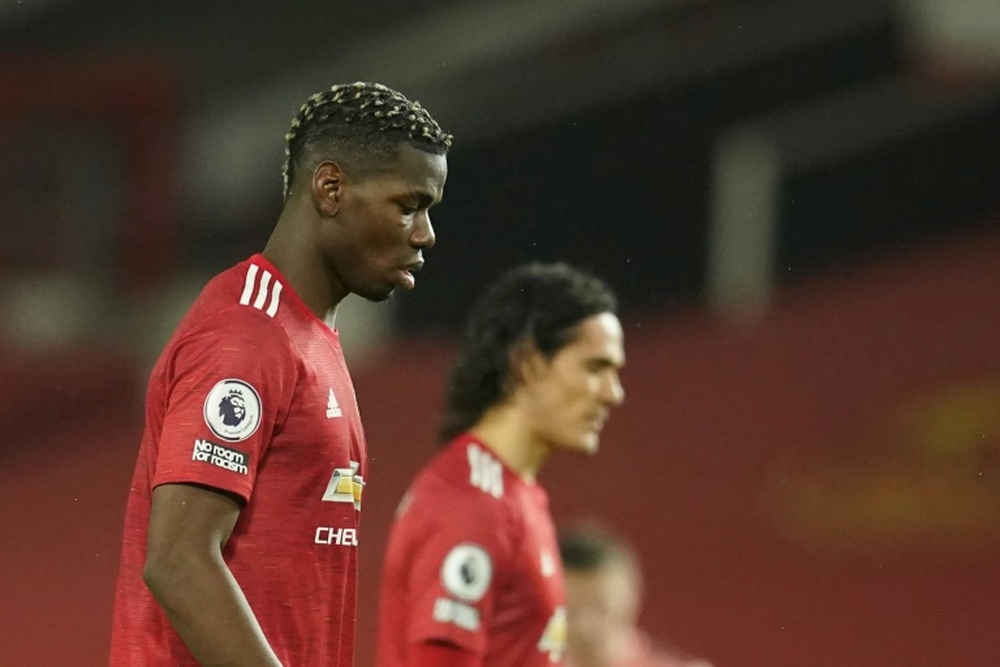 Paul Pogba et Edinson Cavani dépités après la défaite de Manchester United face à Sheffield. AFP